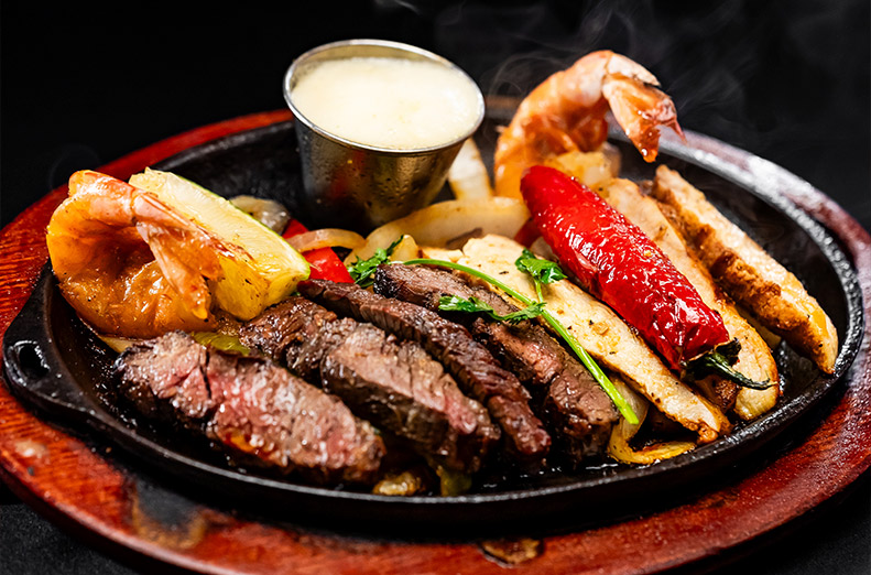 BEEF CHICKEN SHRIMP FAJITAS